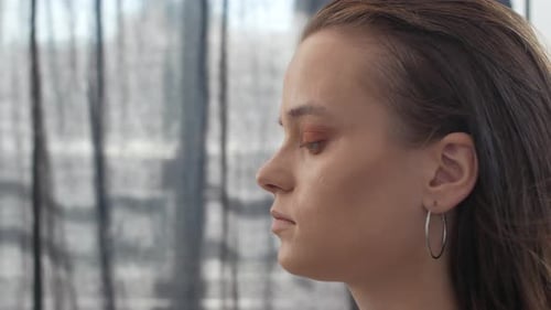 Makeup Artist Applying Makeup to Model's Face Close Up View