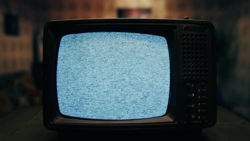 Vintage TV with static and noise in room