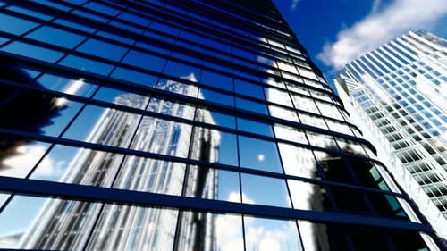 Time Lapse Of White Clouds On The Glass Curtain Wall Of A Business Office Building