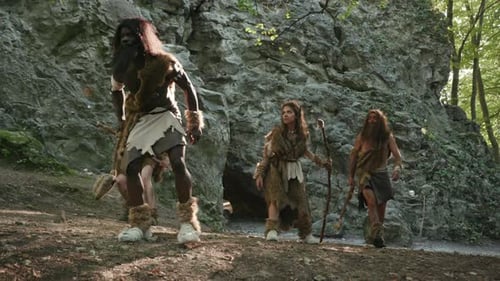 A Prehistoric Scene with Cavemen Engaged in Activities Depicting Ancient Human Life