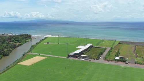 Aerial view of bali united training center by the ocean