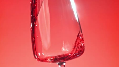 Red Liquid Being Poured into a Glass