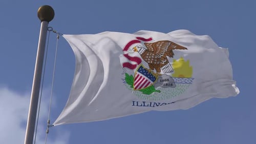 Waving Illinois State Flag Against a Clear Blue Sky