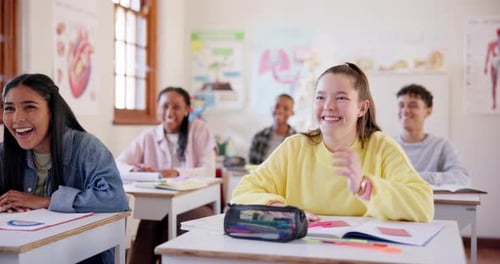 School, smile and student friends laughing in class while learning during an academic lesson