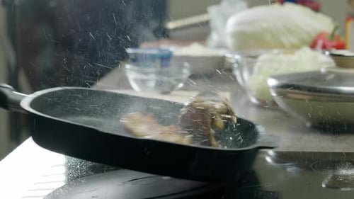 Chicken Cooking in a Pan on Stovetop