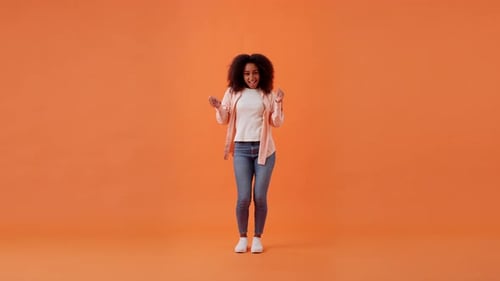 African American Woman Dances in Place Moving Body in Studio