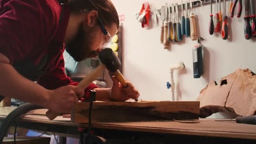 Artist Uses Vice Tool to Clamp Piece of Wood Shaping Log