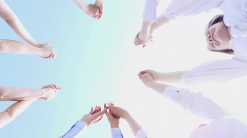 Group of People Join Hands Together