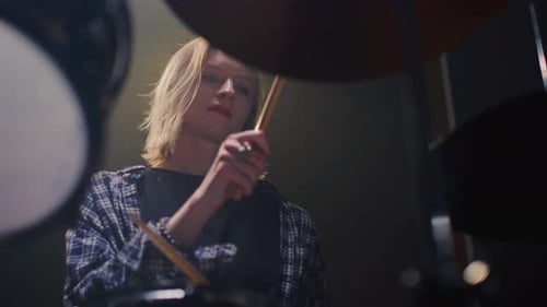 Woman Drummer Plays a Drum Kit Female Musician Beats a Rock Rhythm on Drums Girl Artist is