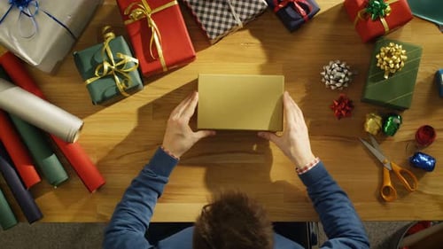 Top View of a Man Closing Beautiful Gift Box. Box Interior is Mock-up Green Screen.