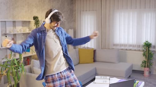 Man Dancing with Headphones in Living Room
