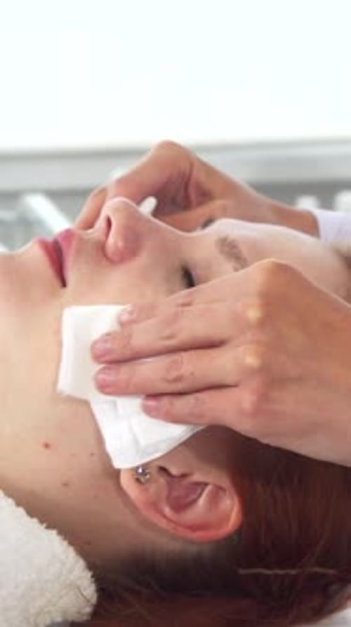 Woman Getting Facial Cleansing at Beauty Treatment