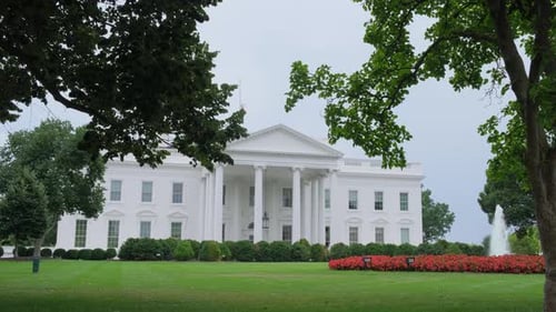 A Serene View of the White House Amidst Lush Greenery and Calm
