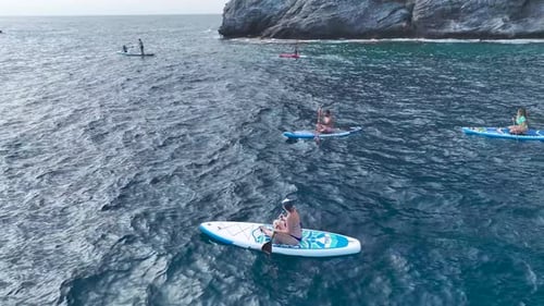 Aerial View Exploring the Clear Waters of a Stunning Lagoon By Paddleboard Scenic Mediterranean