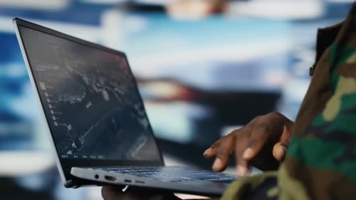 Adult Typing on Laptop Computer at Workplace