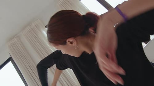 Young Expressive Duet Performing Contemporary Dance in Studio