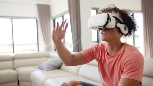 Man Wearing VR Headset Interacting in Virtual Reality