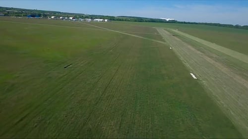 Old Airplane Takes Off From Grass Airstrip of Small Airport Retro Plane Move at Rural Runway and