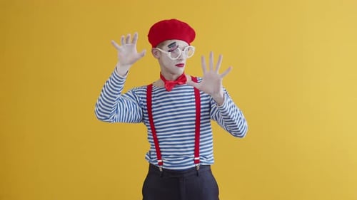 A Young Mime Guy Looking for Weaknesses Voids in the Wall Portrait of a Mime Playing a Funny
