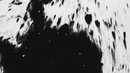 Expanding Black Ink Blot on White Surface