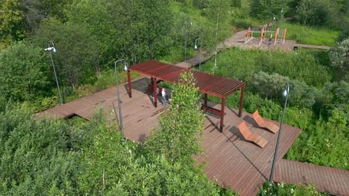 Aerial View of People Relaxing in a Modern City Park Clip
