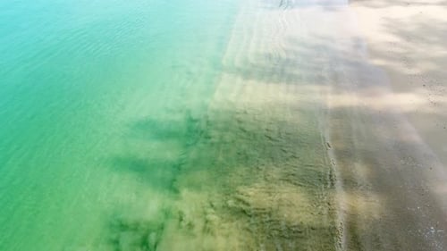 Aerial view drone over beach sea. Beautiful sea waves. Beach sand and amazing sea. Summer sunset sea