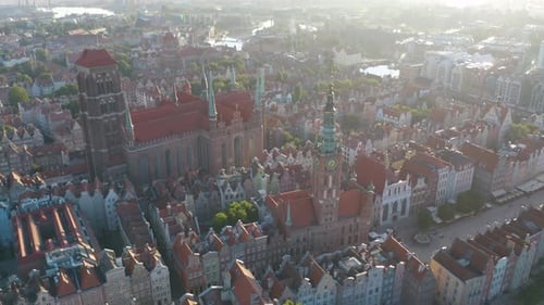 Cinematic Establishing Drone Shot Colorful Houses in Gdansk Old Town, St. Mary's, Town Hall