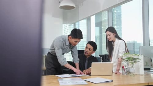 Collaborative Team Working Together in Bright Modern Office