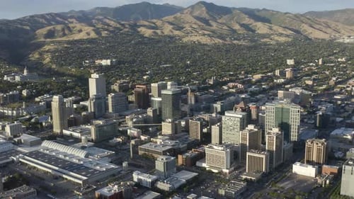 Aerial view of Utah's Salt Lake City with mountains surrounding the downtown area.