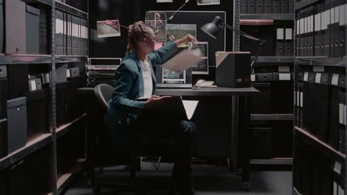Focused Detective Reviews Case Files in Archive Office