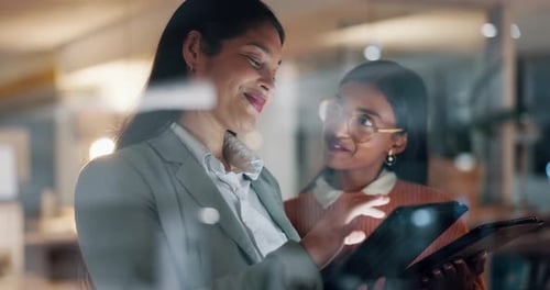 Business women, tablet and teamwork in night office for social media marketing