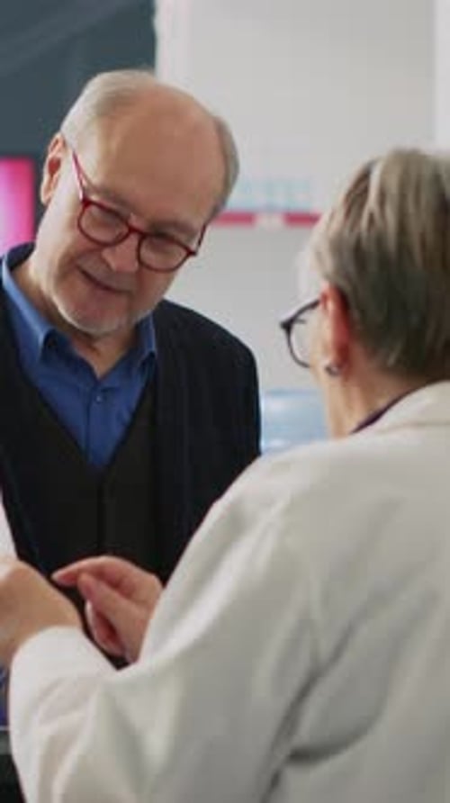 Mature Patient Meeting Doctor in Clinic