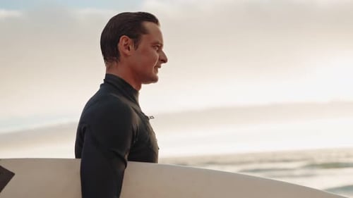 Surfer Walking With Surfboard