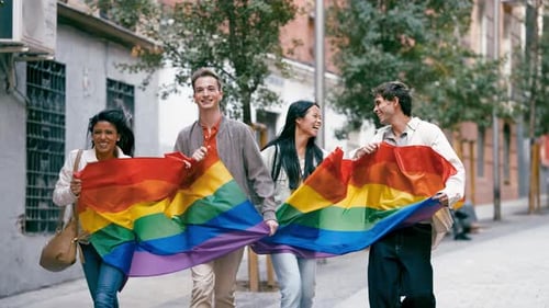 Diverse Group of Friends Marching with Pride Rainbow Flag