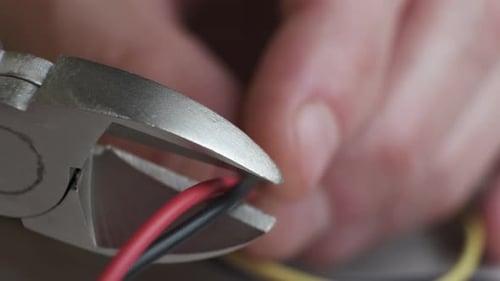 Wire Cutters Cutting Red and Black Wire