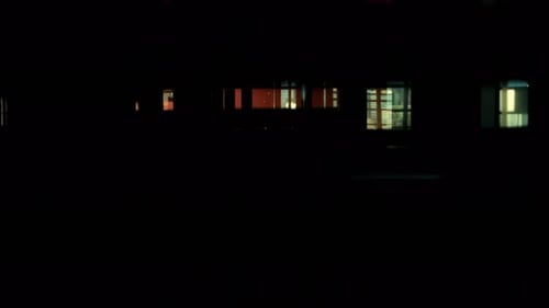 Elevator ascending in modern building at night