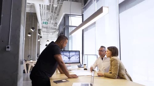 Team Collaboration: Professionals Meeting in Modern Workspace
