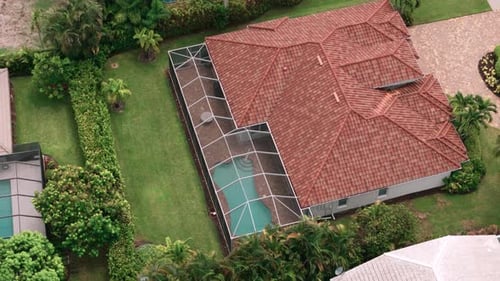 Aerial Above Wide View of Screened in Pool in Florida House Top Down Move Shot