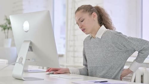 Hardworking Young Male Doctor using Tablet in Modern Office