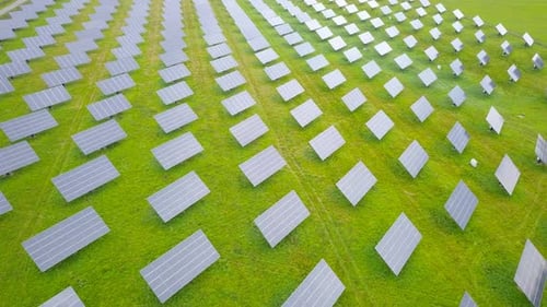 Aerial footage of Solar panels spread across a Solar farm