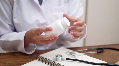 Doctor Explaining Medication in Her Office