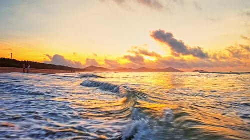 Aerial Top view of a transparent blue sea with beautiful waves at sunny day in summer. air of ocean