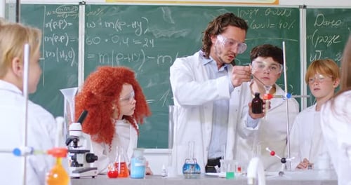 Enthusiastic Students Engaging in Science Experiment with Teacher