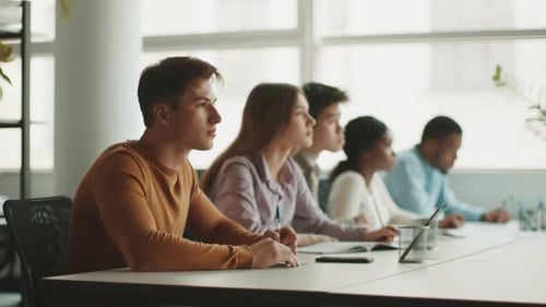 Students Engaged in Focused Study Session at University During Daytime
