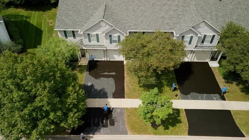 Aerial View of Driveway Sealing Service in Suburbs