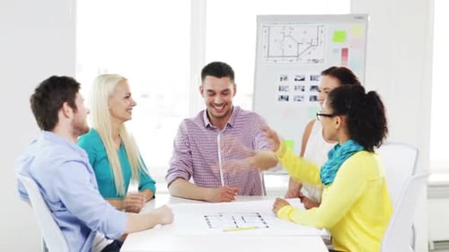 Business Office Gesture and Startup Concept - Smiling Creative Team with Hands