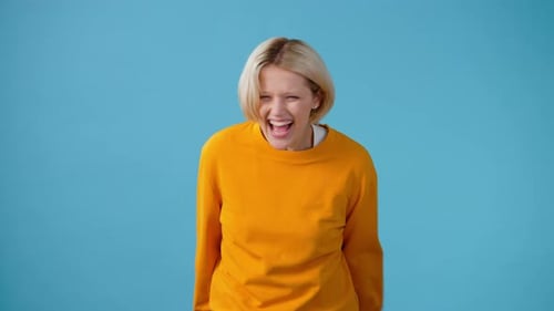 Expressive Woman Displaying Range of Emotions on Blue