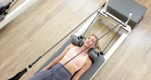Woman Doing Pilates Exercise From Above