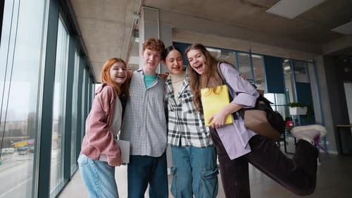 Group of Happy Students Friends Hugging in College