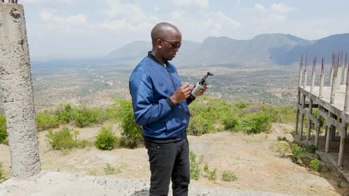 African engineer inspector surveillance operating drone pilot. Drone pilot engineer uav copter techn